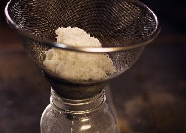 Straining coconut milk.