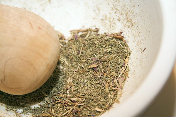 This is hyssop, of the dried variety, almost ground to completion with a mortar and pestle.